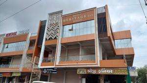 a building on the corner of a street at Hotel O Heritage Inn in Mehsāna +3 photos