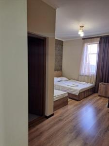 Postel nebo postele na pokoji v ubytování AGA HOTEL & Restaurant