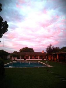 a house with a swimming pool in a yard at Monte CHORA CASCAS in Montemor-o-Novo