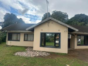 a house with a large window on the side of it at Empangeni guest house 2 in Empangeni