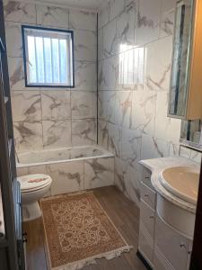 a bathroom with a tub and a toilet and a sink at Santa Ana En La Playa Lo Pagan in San Pedro del Pinatar +26 photos