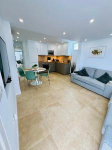 a living room with a couch and a table at Bungalow Mesana 27 in Playa Honda