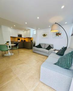 a large living room with a couch and a table at Bungalow Mesana 27 in Playa Honda +12 photos