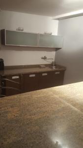 a kitchen with a counter top and a sink at Dom nad Gwdą in Piła +6 photos