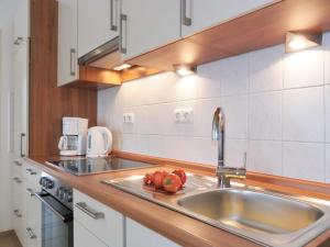 Η κουζίνα ή μικρή κουζίνα στο Seestern Whg 4 50