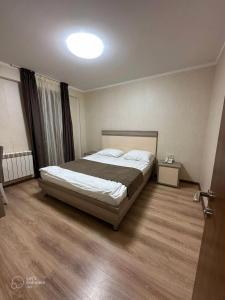 Ένα ή περισσότερα κρεβάτια σε δωμάτιο στο Orbi Palace Bakuriani 101