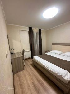 Ένα ή περισσότερα κρεβάτια σε δωμάτιο στο Orbi Palace Bakuriani 101 +10 φωτογραφίες