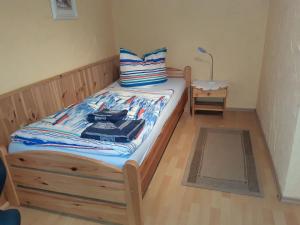 Ένα ή περισσότερα κρεβάτια σε δωμάτιο στο Urlaub bei Monsieur Pigard 42001