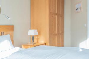 Ein Bett oder Betten in einem Zimmer der Unterkunft Seepark Sellin FeWo AG Whg 314