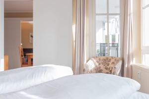 Ein Bett oder Betten in einem Zimmer der Unterkunft Seepark Sellin FeWo AG Whg 314