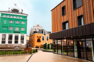 a group of buildings next to a street at De Brauhotel - Hôtel de la Brasserie Nationale in Bascharage