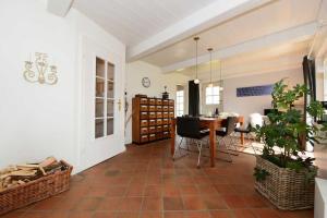 a living room with a table and a dining room at Haus Kliffkante 1 Goting in Goting