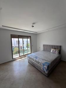 Ένα ή περισσότερα κρεβάτια σε δωμάτιο στο Villa dans un résidence privée a El Jadida
