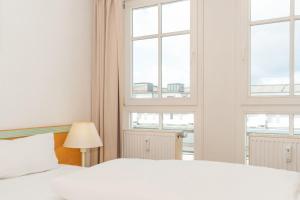 Ein Bett oder Betten in einem Zimmer der Unterkunft Seepark Sellin FeWo AG Whg 383