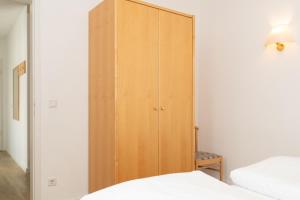 Ein Bett oder Betten in einem Zimmer der Unterkunft Seepark Sellin FeWo AG Whg 383