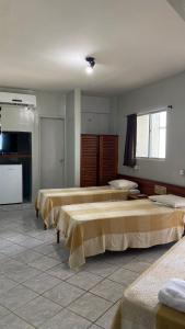 a group of beds in a large room at Hotel e Restaurante Samburá in Olinda +38 photos