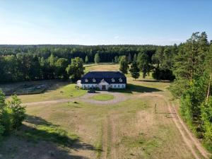 an aerial view of a large house in a field at Dawno Temu - Agroturystyka Premium in Lipowy Most