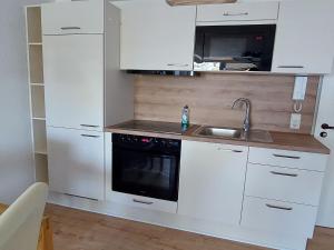 Køkken eller tekøkken på Blaumuschel Haus A Wohnung 19 - DH + 10 billeder