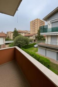 a balcony of a building with a view of a yard at Alloggio Privato - Parking Free - Tram a 300m in Volta Barozzo