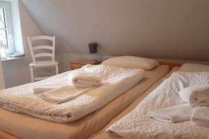 Postel nebo postele na pokoji v ubytování Sandkörnchen Haus Faltings Whg 3 OG mit Balkon