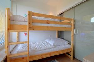 Ein Bett oder Betten in einem Zimmer der Unterkunft Apartment 255