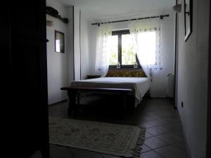 Ένα ή περισσότερα κρεβάτια σε δωμάτιο στο Ciabòt Taricchi