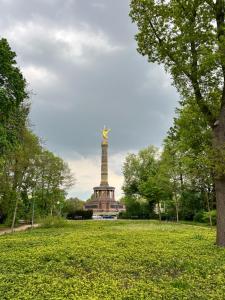 a monument in the middle of a park with trees at Berlin -Central-Mitte Light Filled 2BD in Niederdorla