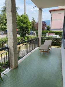 a balcony with a bench and a railing at La VILLA REGAL in Brescia