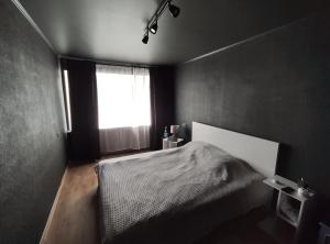 Ένα ή περισσότερα κρεβάτια σε δωμάτιο στο Kauguri apartment residence