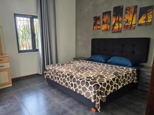 Una cama o camas en una habitación de Villa Ch'ti Mauricienne