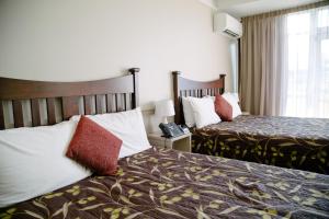 Postel nebo postele na pokoji v ubytování Hotel Ashburton
