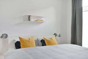 Ein Bett oder Betten in einem Zimmer der Unterkunft KOSI am Meer ACHT
