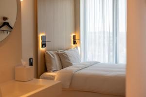 Voodi või voodid majutusasutuse NOTO Hotel toas