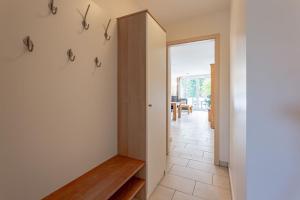 a hallway with a door leading to a dining room at Schloss am Meer 9 in Wyk auf Föhr