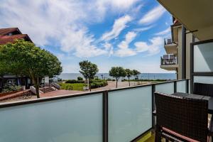 a balcony with a view of the ocean at Schloss am Meer 9 in Wyk auf Föhr