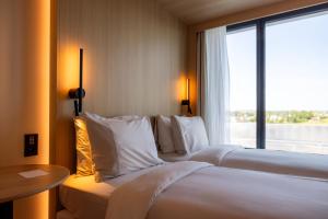 Voodi või voodid majutusasutuse NOTO Hotel toas