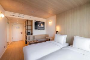 Voodi või voodid majutusasutuse NOTO Hotel toas