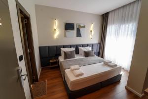 Voodi või voodid majutusasutuse Vion Sea Boutique Hotel - Golem Durrës toas