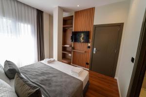 Televiisor ja/või meelelahutuskeskus majutusasutuses Vion Sea Boutique Hotel - Golem Durrës