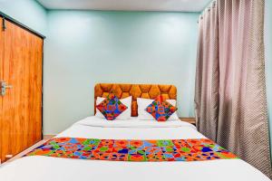 Postel nebo postele na pokoji v ubytování FabHotel Emara Inn