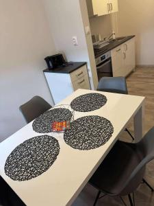 a table with black and white decorations on it in a kitchen at MiDo in Zalaegerszeg +5 photos