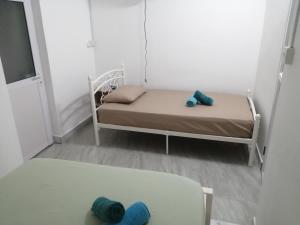 Postel nebo postele na pokoji v ubytování Ô Bercail du Sud-Hibiscus chez Jeannette