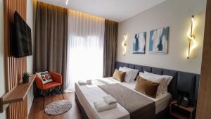Televiisor ja/või meelelahutuskeskus majutusasutuses Vion Sea Boutique Hotel - Golem Durrës