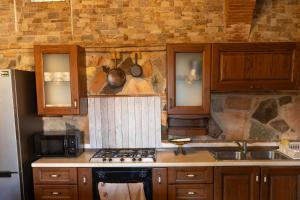 a kitchen with a sink and a stove top oven at Vacation Home Tuscany Pisa-Lucca 1 in Filettole