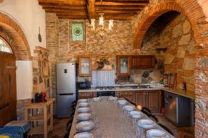 a kitchen with a long table with plates on it at Vacation Home Tuscany Pisa-Lucca 1 in Filettole