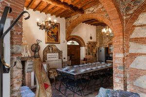 a dining room with a long table in a building at Vacation Home Tuscany Pisa-Lucca 1 in Filettole