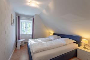 Postel nebo postele na pokoji v ubytování Haus Strandruhe