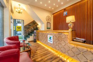 Un lugar para sentarse en Treebo Premium Bridge View Regency, Mall Road
