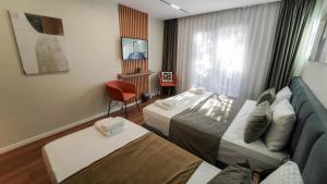 Voodi või voodid majutusasutuse Vion Sea Boutique Hotel - Golem Durrës toas