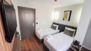 Voodi või voodid majutusasutuse Vion Sea Boutique Hotel - Golem Durrës toas